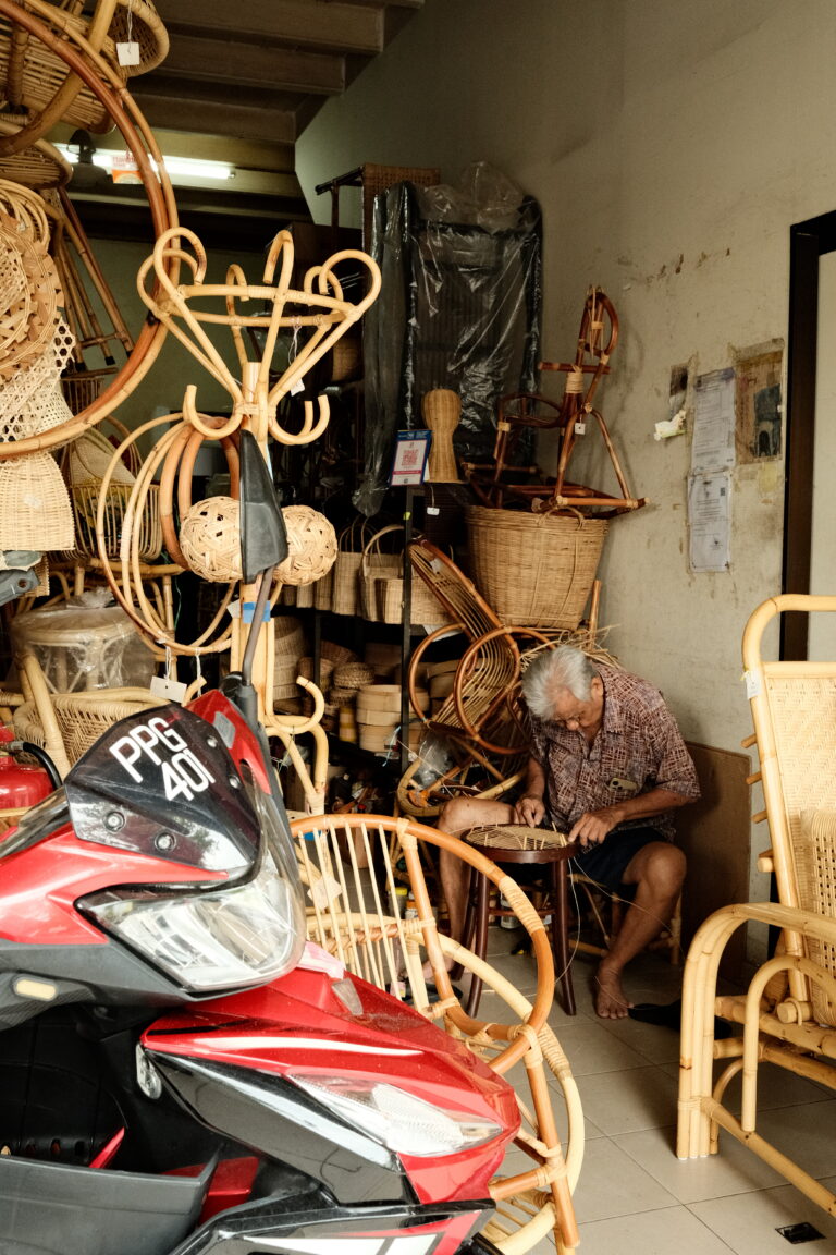A old man knotting a basket in Georgetown, Malaysia